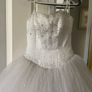 Wedding dress size 8 Color white and front and net Flare with white beads